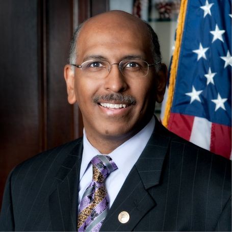 Michael Steele in a formal portrait in front of the American Flag.